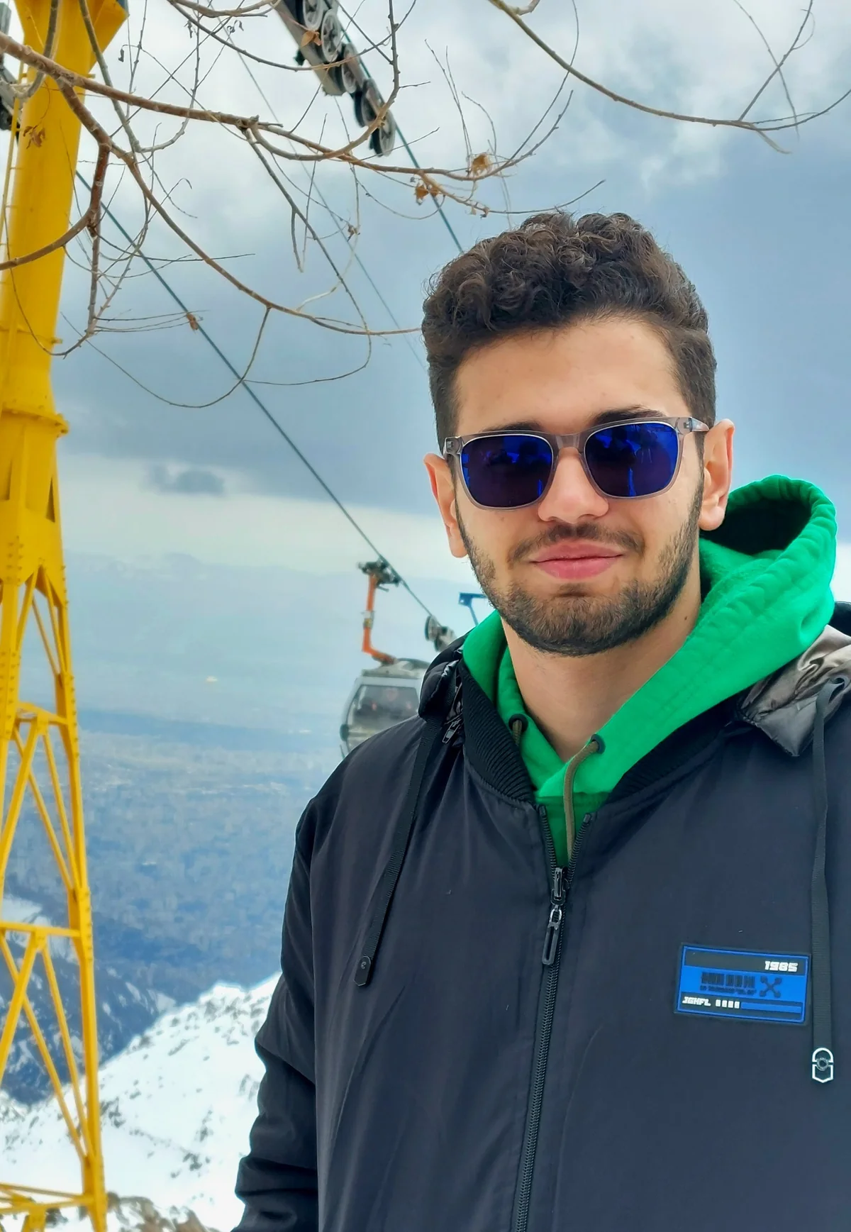 Ali Ghorbani Bargani at a snowy mountain viewpoint